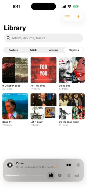 1-bit library — a grid of album artwork with the mini-player docked at the bottom