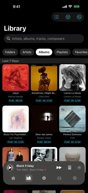1-bit library — a grid of album artwork under a row of section chips: Folders, Artists, Albums, Playlists, Favorites
